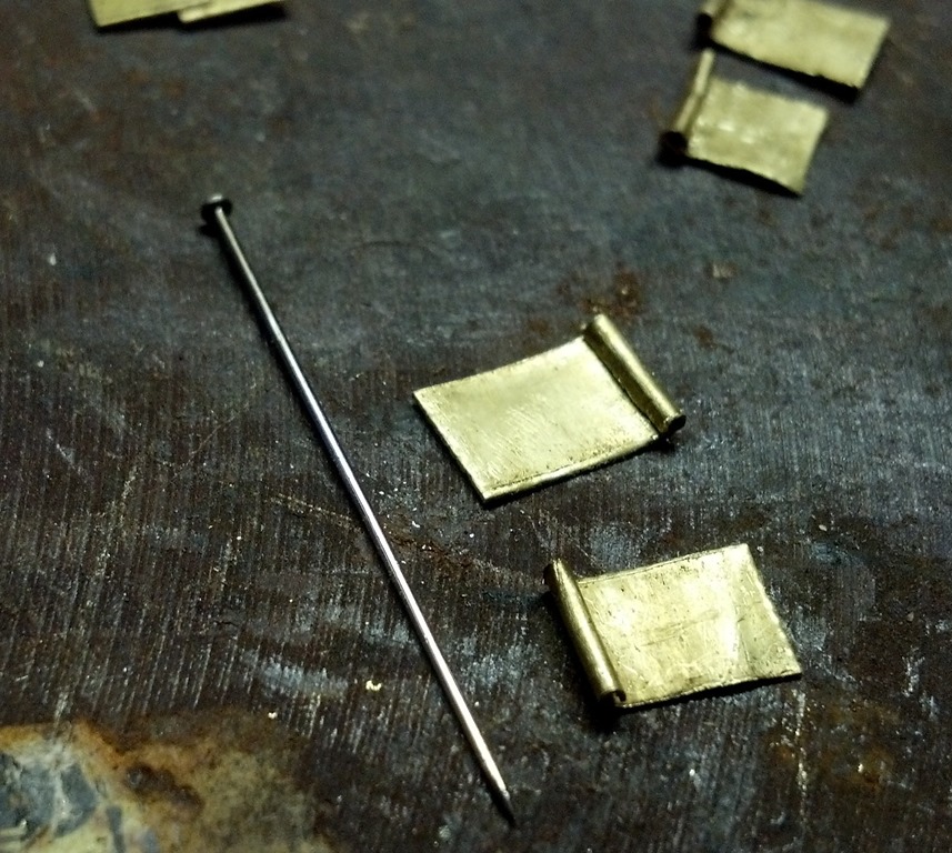 brass strips with cylinder folded into one side