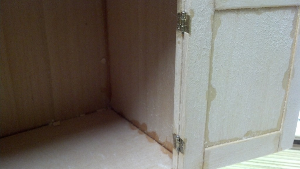 inside view of installed scale hinges mounted to the cabinet and door