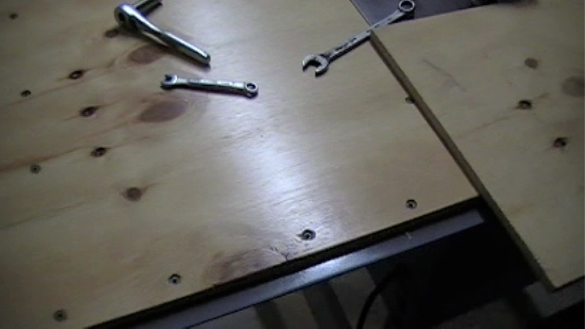 plywood screwed down to tablesaw wing extension