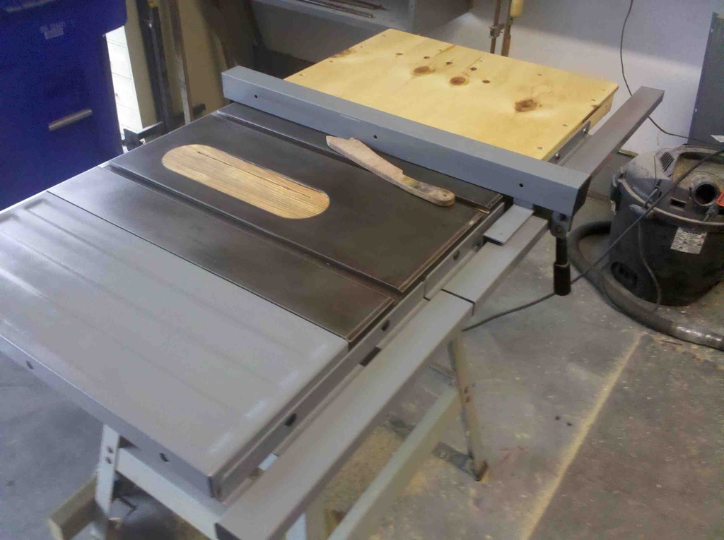 refurbished table saw with plywood side extension added