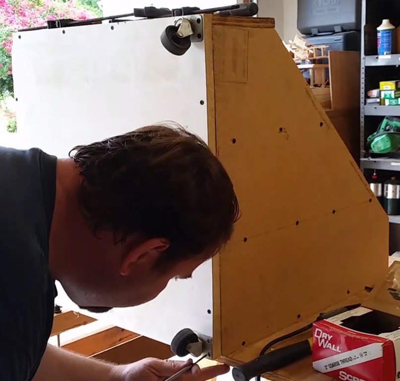 Adding casters to the bottom of the storage bin