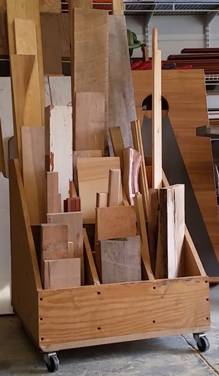 Wood storage bin filled with cutoffs and scrap pieces