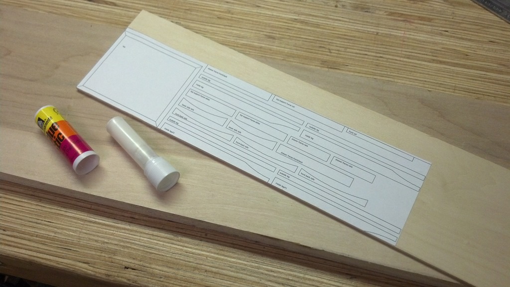 Full-size paper templates attached to basswood sheets