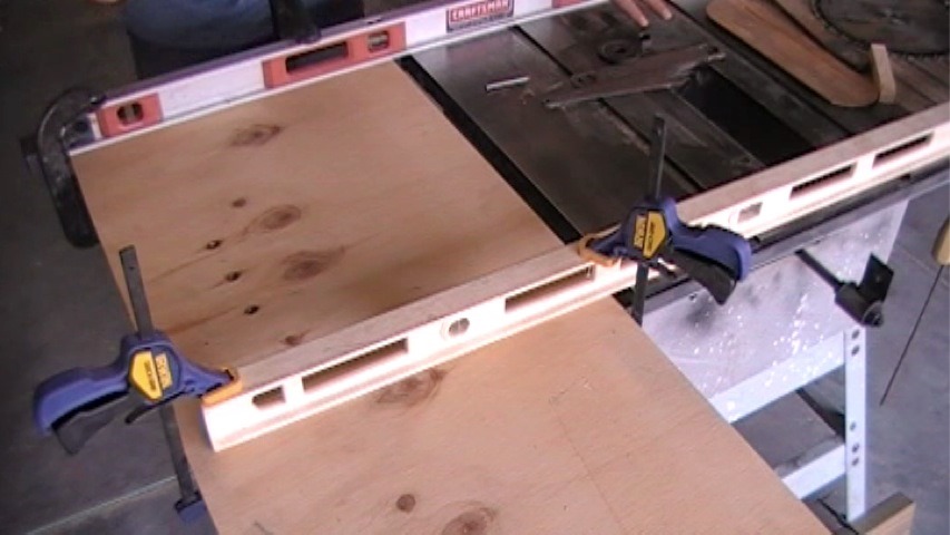 Mocked up table saw extension held up with two 4 foot levels