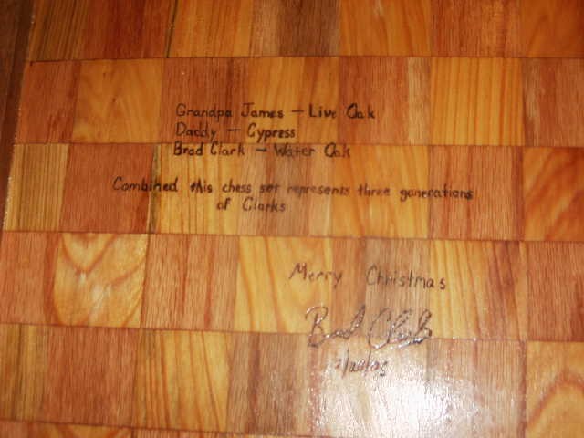 back of the chess board with woodburned message